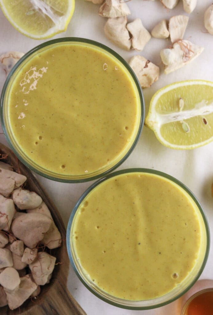 Creamy baobab smoothie with ginger, mango, and yogurt packed with vitamin C, fiber, and antioxidants.